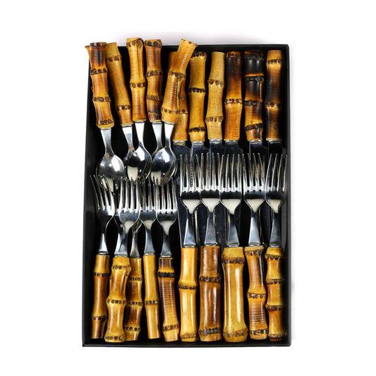 A set of bamboo handle flatware including table spoons, teaspoons, table forks, and table knives arranged neatly.